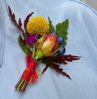 A matching boutonnière filled with meaning. Foraged Florals. Photo by Karen Bennett.